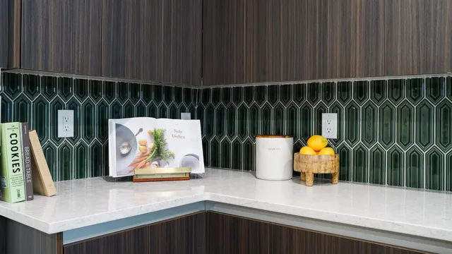 a living room with furniture and view of kitchen