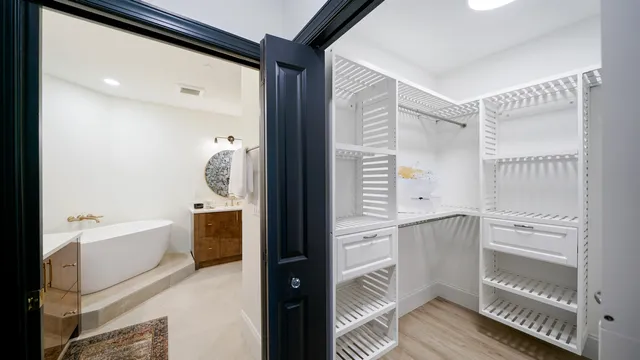 a bedroom with a bed and a couch