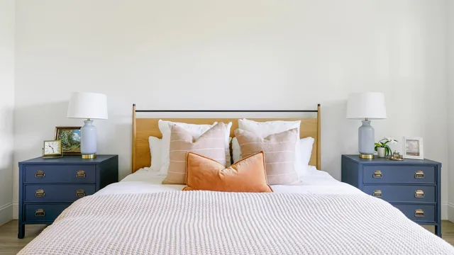 a bathroom with a double vanity sink mirror and bathtub
