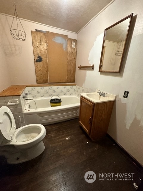 7403 Beverly Boulevard Everett, WA 98203 - Photo 14 of 21 a bathroom with a sink a toilet and mirror