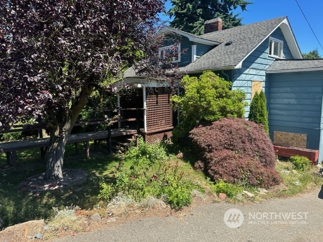 7403 Beverly Boulevard Everett, WA 98203 - Photo 2 of 21 a view of a house with a yard and potted plants