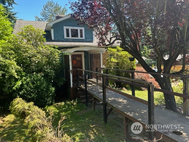 7403 Beverly Boulevard Everett, WA 98203 - Photo 3 of 21 a front view of a house with garden