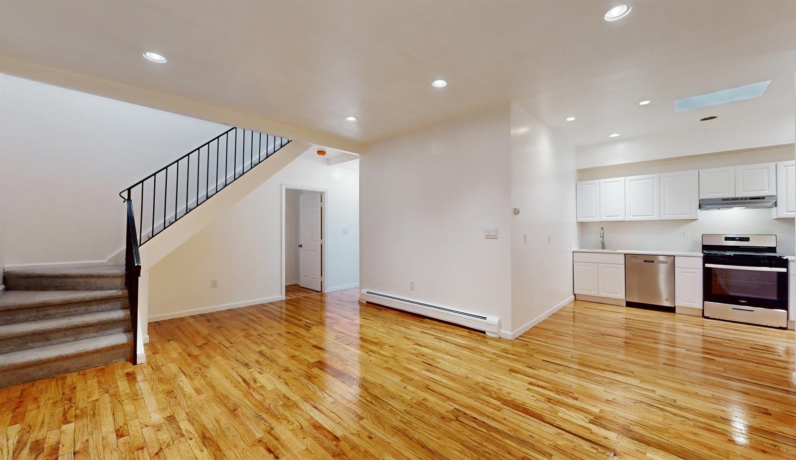 a view of kitchen and wooden floor
