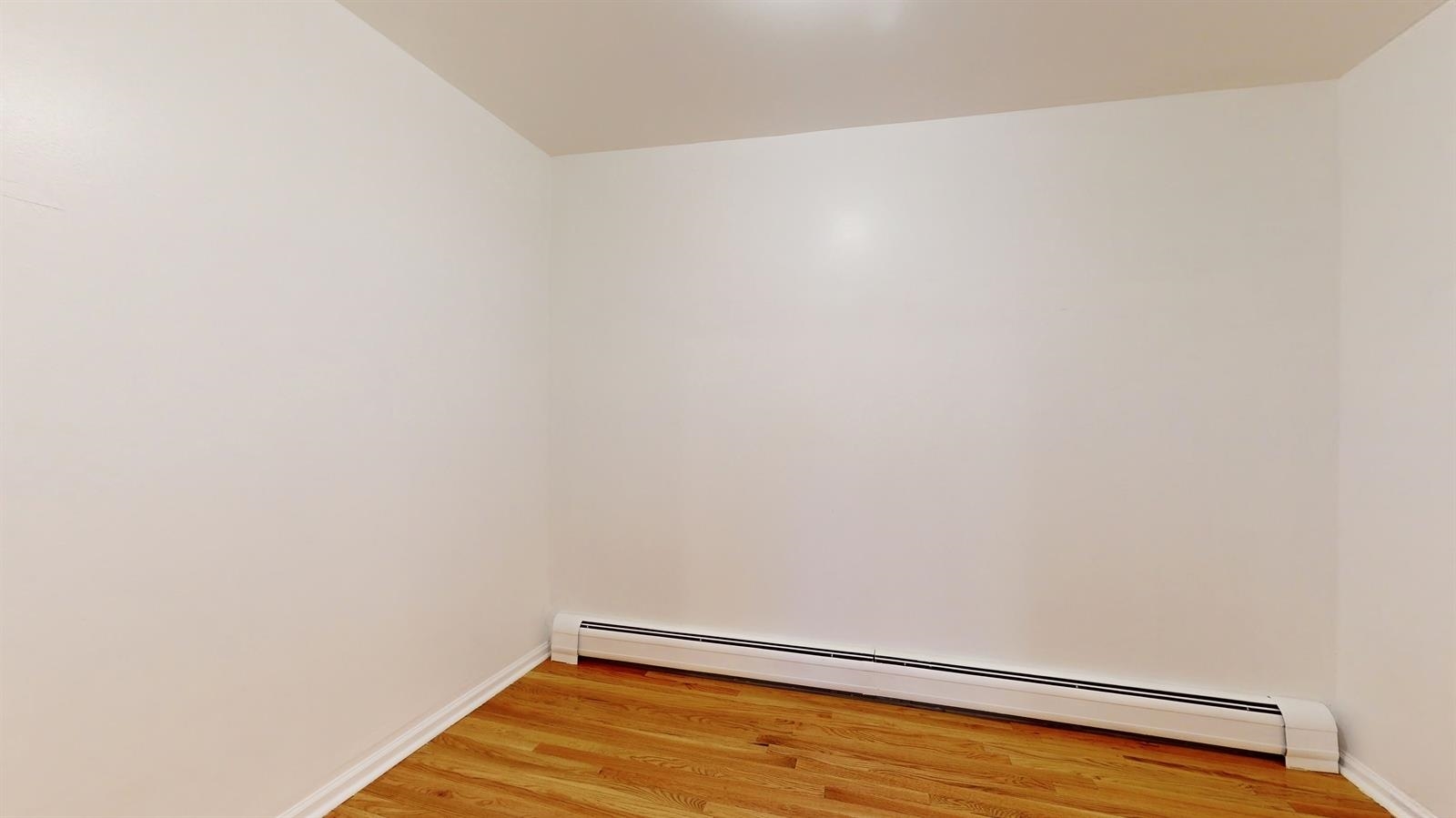 604 4th Street Hoboken, NJ 07030 - Photo 25 of 30 a view of a room with wooden floor