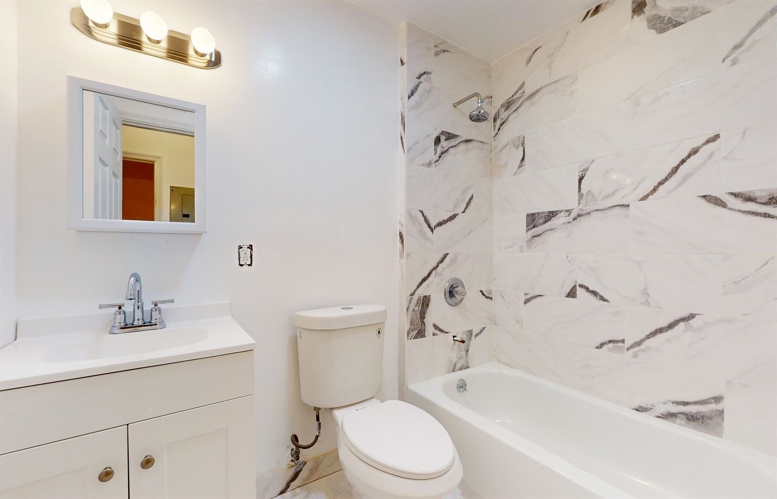604 4th Street Hoboken, NJ 07030 - Photo 26 of 30 a bathroom with a sink toilet and shower