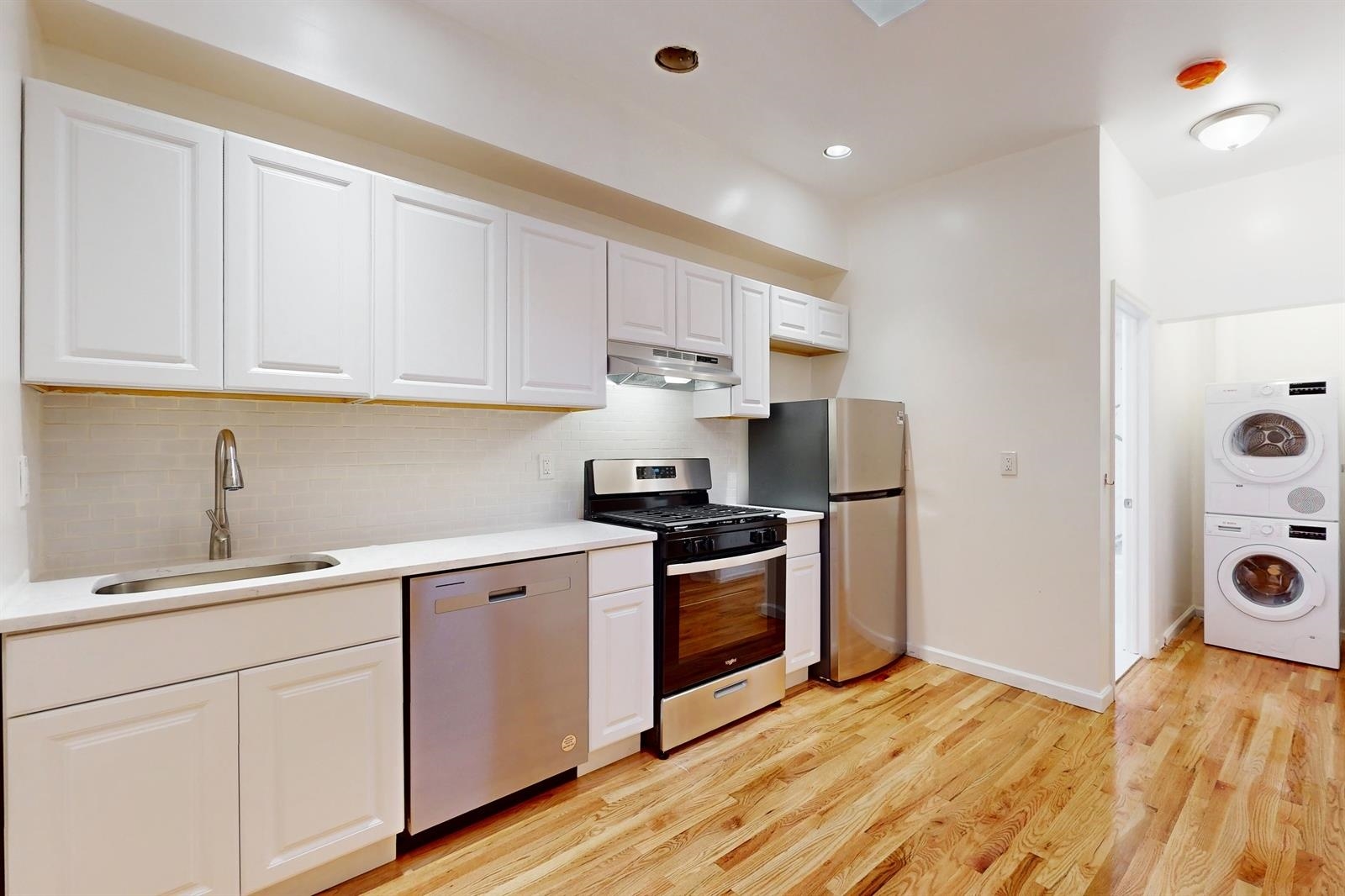 604 4th Street Hoboken, NJ 07030 - Photo 6 of 30 a kitchen with a sink and cabinets