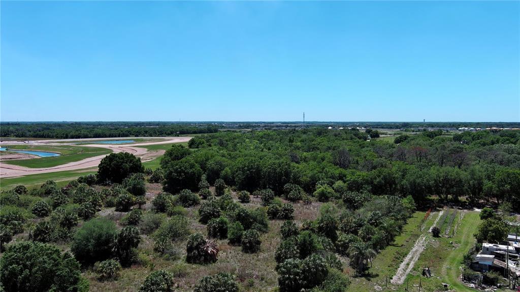 12870 Grass Farm Road Palmetto, FL 34221 - Photo 3 of 5 an aerial view of a houses with a yard