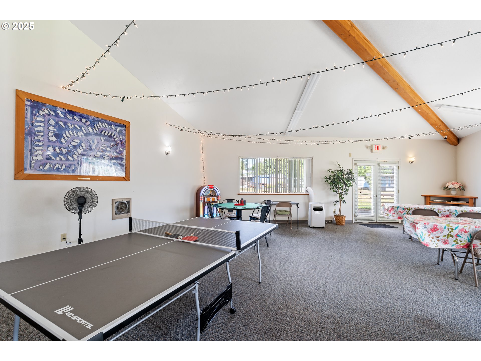 1625 Henderson Avenue Eugene, OR 97403 - Photo 11 of 20 a living room with furniture a flat screen tv and a table