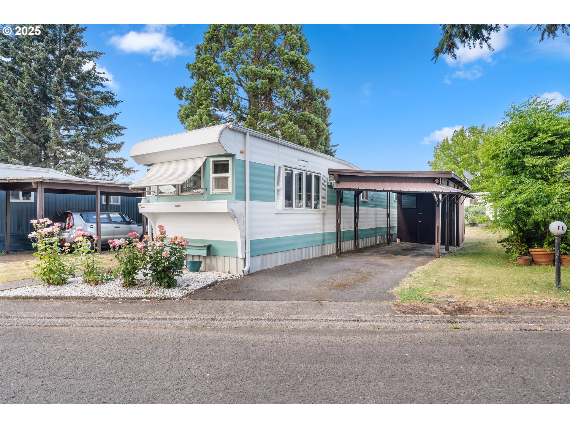 1625 Henderson Avenue Eugene, OR 97403 - Photo 2 of 20 a front view of a house with a yard and potted plants