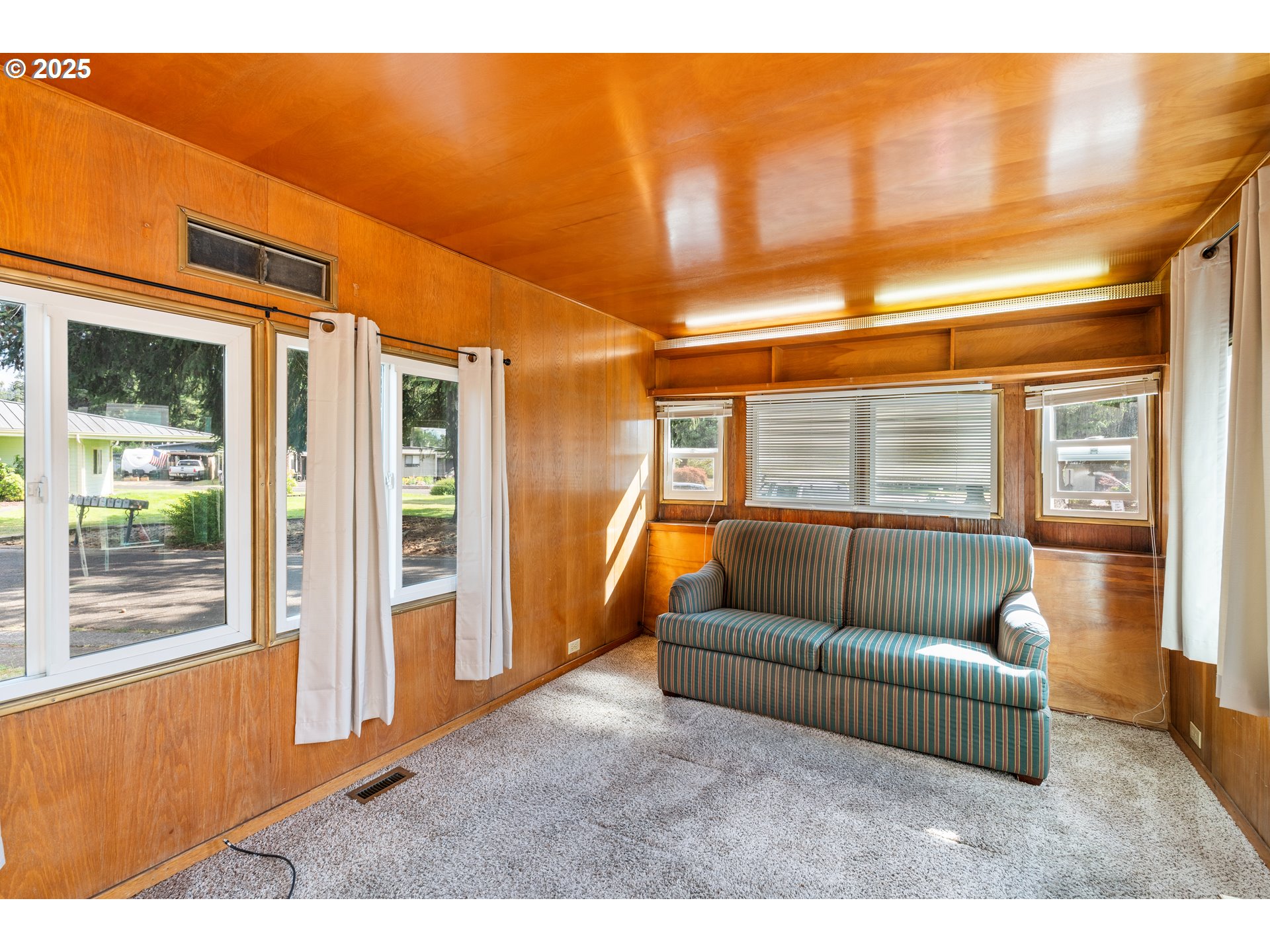 1625 Henderson Avenue Eugene, OR 97403 - Photo 4 of 20 a living room with furniture and a large window