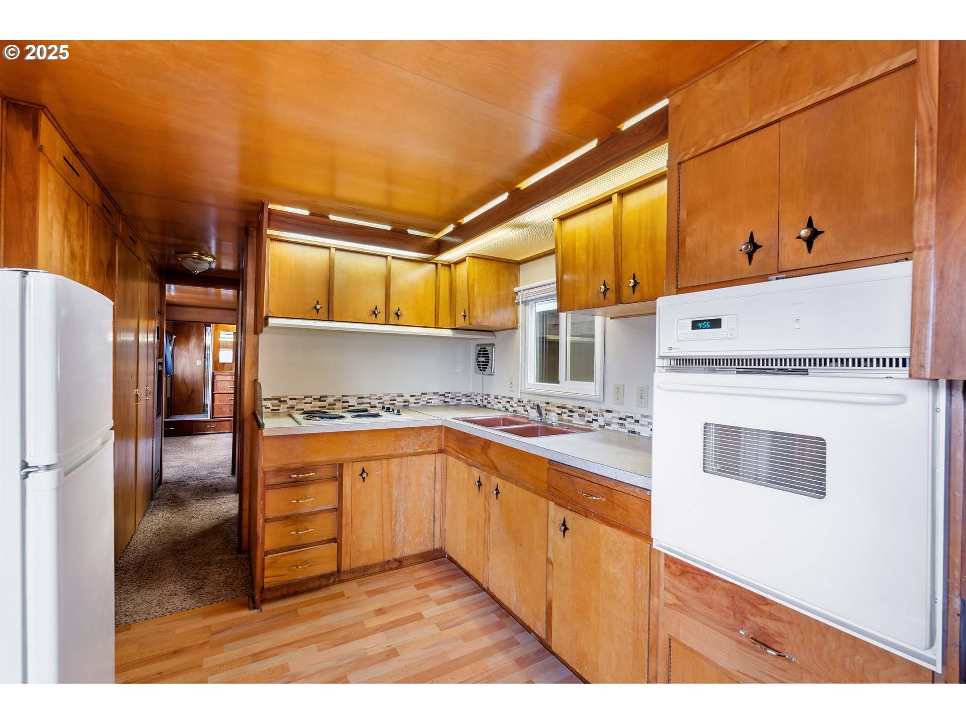 1625 Henderson Avenue Eugene, OR 97403 - Photo 6 of 20 a kitchen with stainless steel appliances granite countertop a sink and cabinets