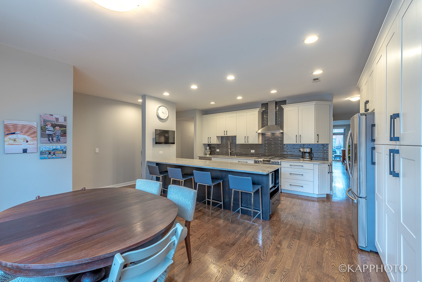 27 North Racine Avenue, Unit 432 Chicago, IL 60607 - Photo 12 of 28 a kitchen with a table chairs refrigerator and cabinets