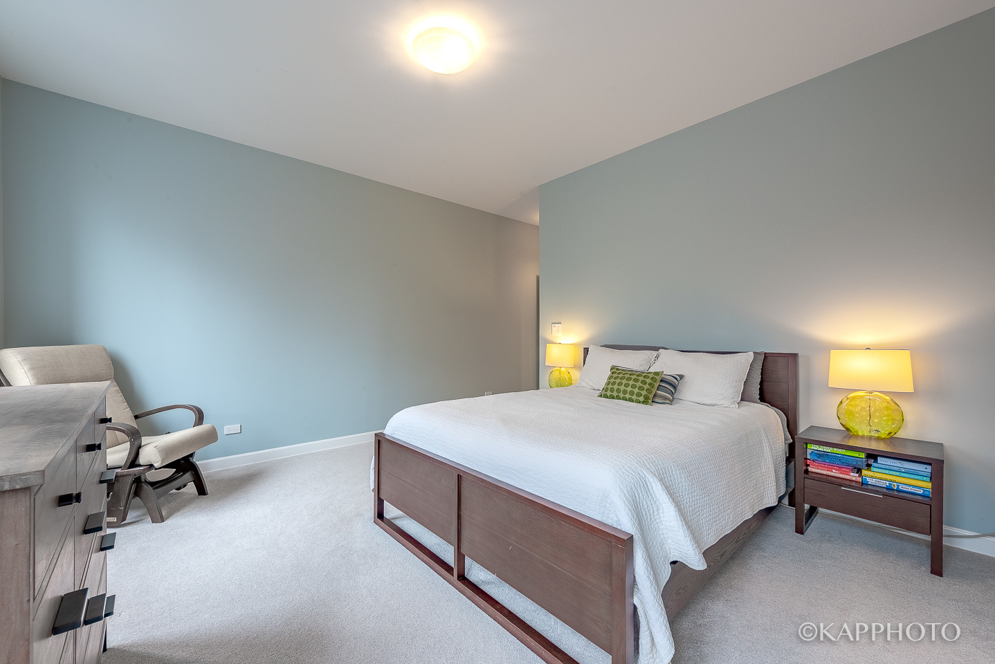 27 North Racine Avenue, Unit 432 Chicago, IL 60607 - Photo 16 of 28 a bedroom with a bed and a chair