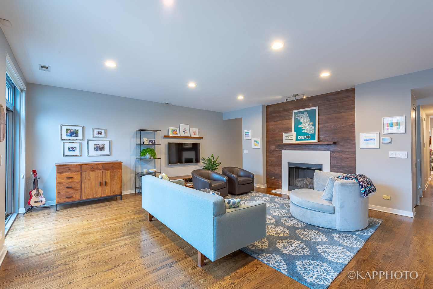 27 North Racine Avenue, Unit 432 Chicago, IL 60607 - Photo 5 of 28 a living room with furniture a fireplace a flat screen tv and kitchen island