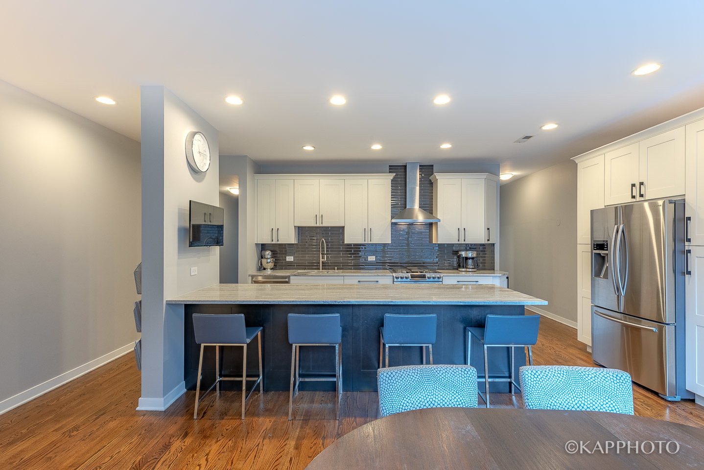 27 North Racine Avenue, Unit 432 Chicago, IL 60607 - Photo 10 of 28 a kitchen with stainless steel appliances granite countertop a table chairs sink refrigerator and cabinets