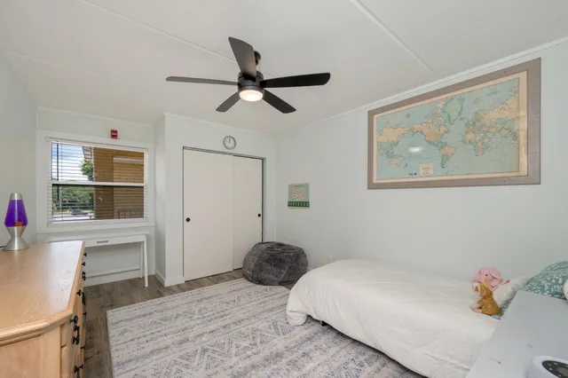 a living room with furniture a window and a chandelier