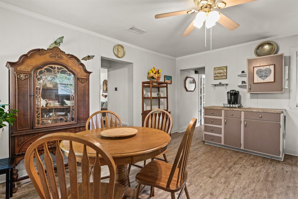 103 South Sun Camp Road White Oak, TX 75693 - Photo 16 of 40 a view of a dining room with furniture window and wooden floor
