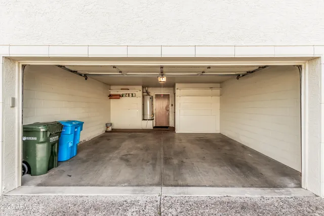 a front view of a house with swimming pool and furniture