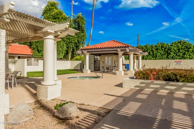 a view of swimming pool with outdoor seating and a patio