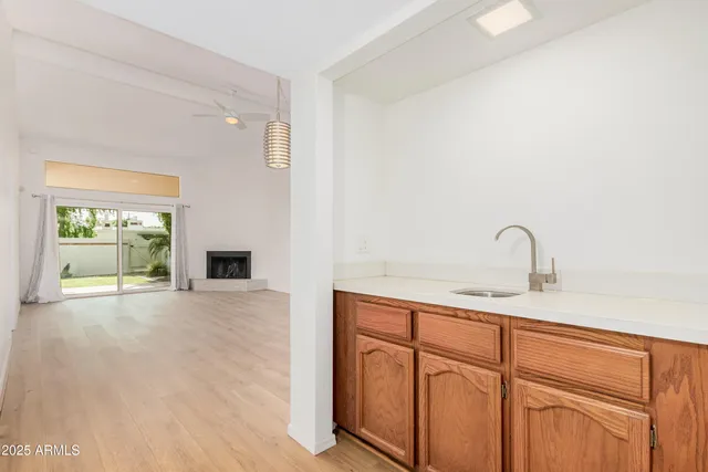 a view of a kitchen with a sink and a window