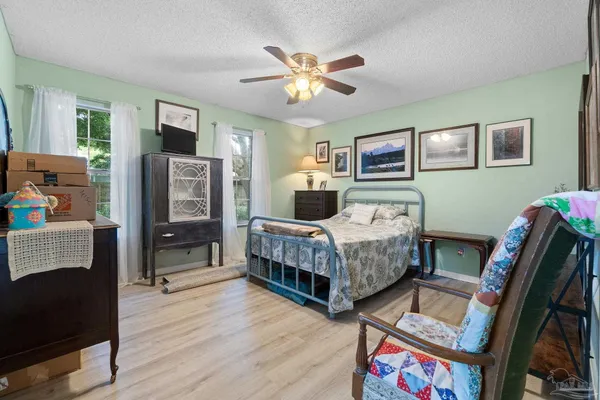 a bedroom with a bed and a dresser