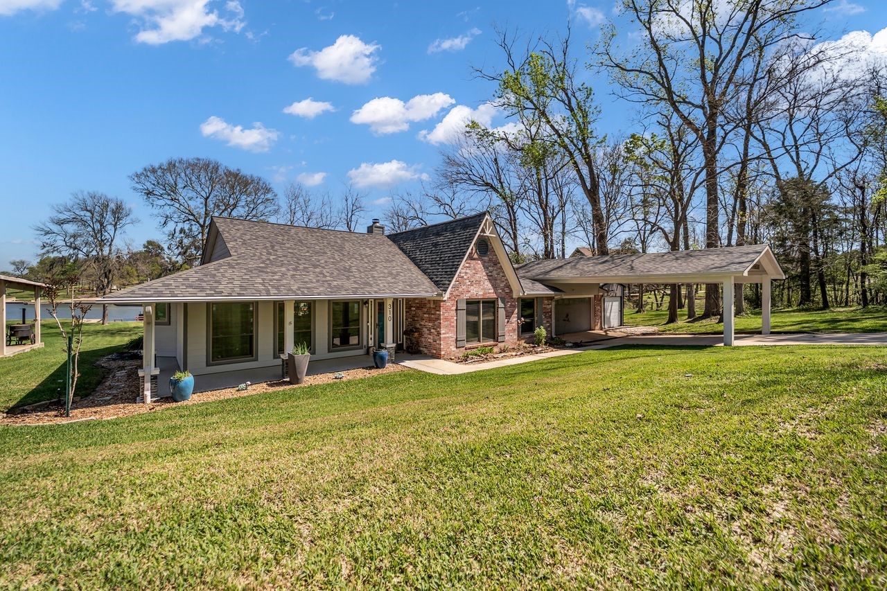 310 Cove Loop Coldspring, TX 77331 - Photo 4 of 48 Almost 1/2 an acre water front lot, this home has been updated from top to bottom!