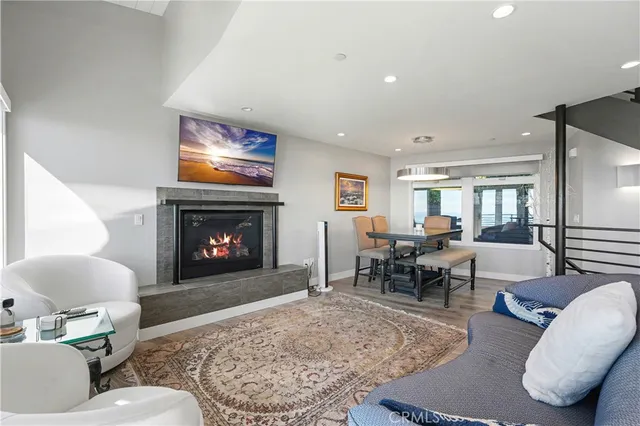 a living room with furniture and stairs