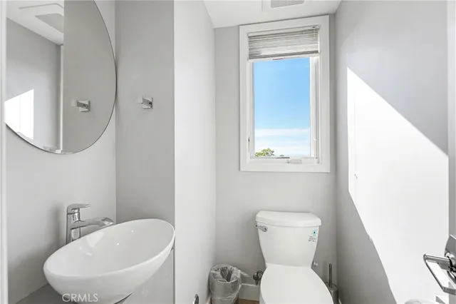 a kitchen with refrigerator cabinets and chairs