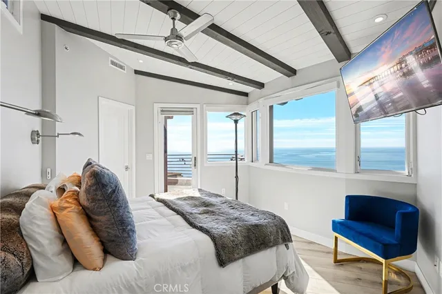 a bathroom with a granite countertop sink a mirror and shower