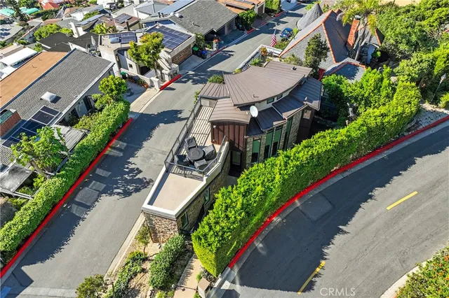 an aerial view of residential houses with trees