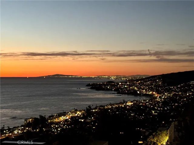 a view of ocean with mountain