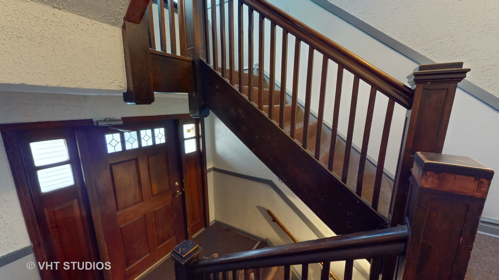 3122 Wisconsin Avenue Berwyn, IL 60402 - Photo 4 of 32 a view of staircase with railing and a window