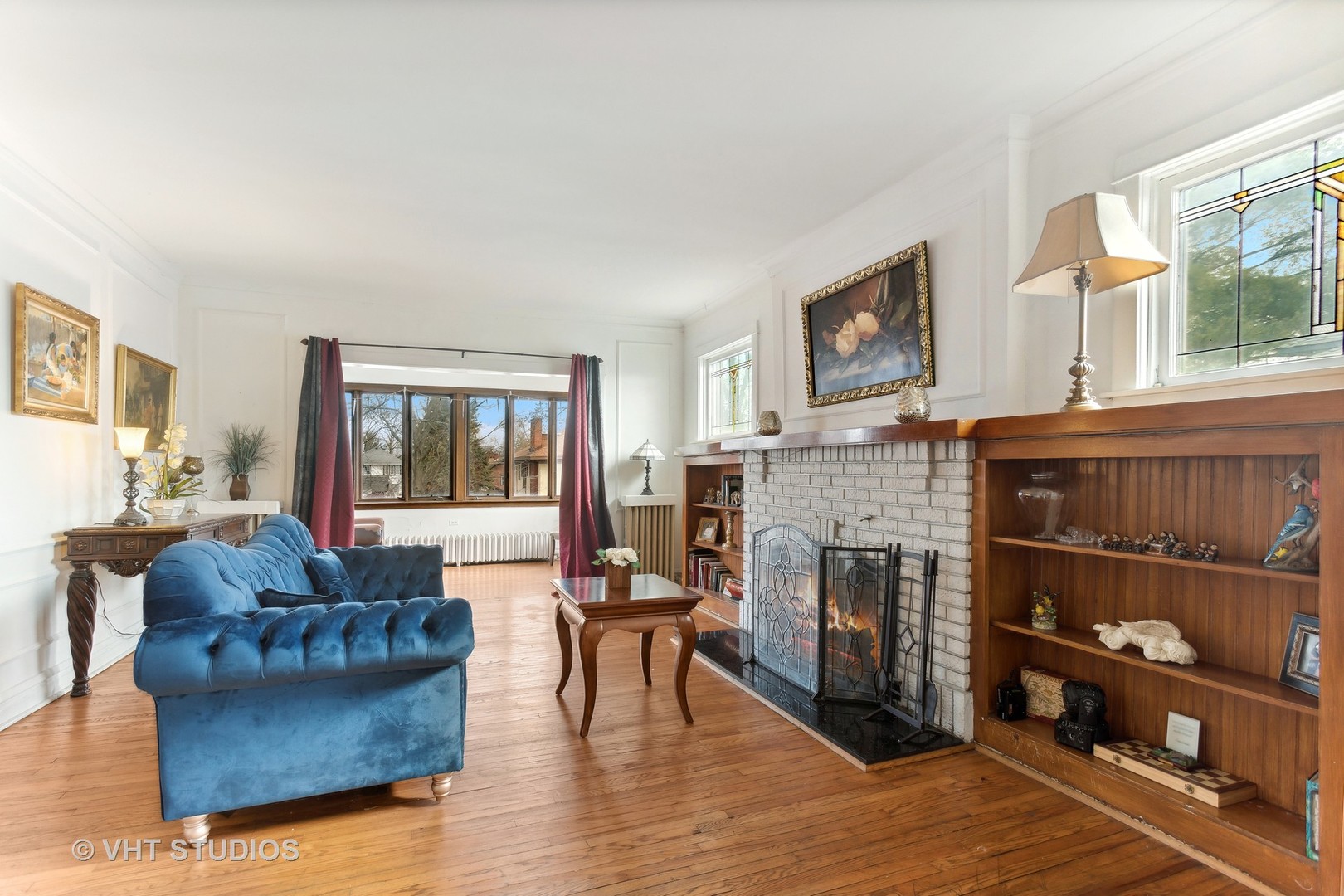 3122 Wisconsin Avenue Berwyn, IL 60402 - Photo 8 of 32 a living room with furniture and a fireplace