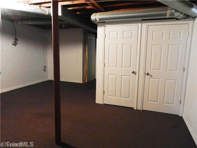 171 Cana Road Mocksville, NC 27028 - Photo 14 of 16 Workshop. Spacious room in basement, includes a large workbench wired with electric, perfect for a hobbyist