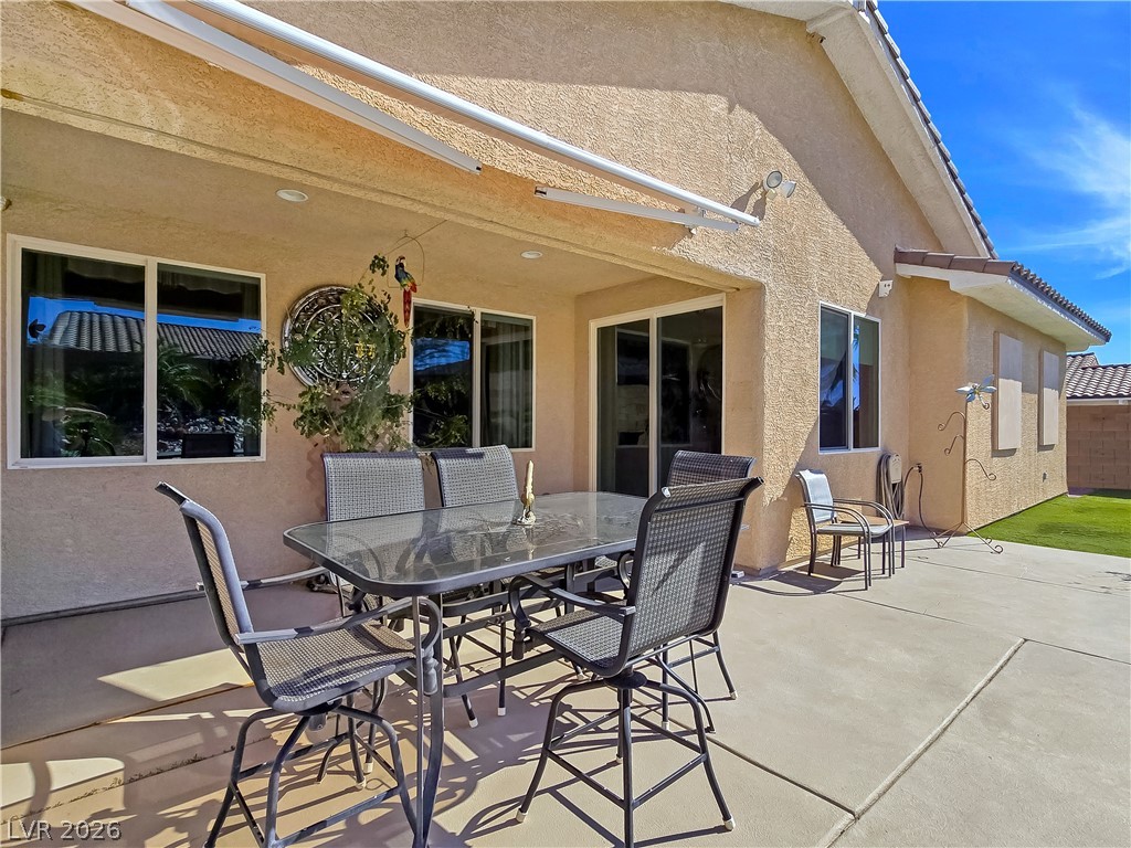 2485 Morrow Ridge Place Laughlin, NV 89029 - Photo 32 of 40 Concrete patio provides ample space for outdoor dining and relaxation with direct home access.