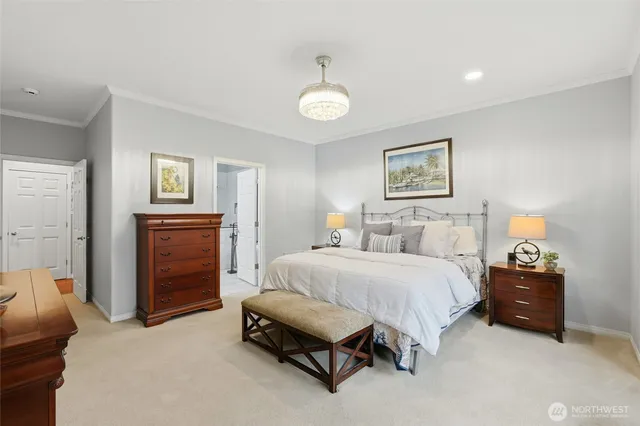 a spacious bedroom with a bed and a cabinets
