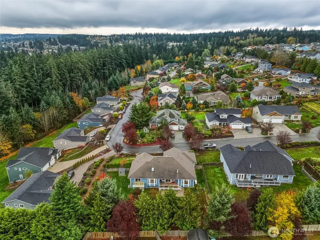 an aerial view of residential houses with outdoor space