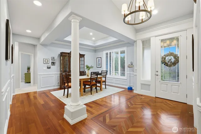 a view of a living room and chandelier