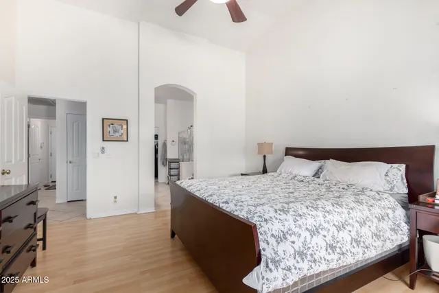 a bedroom with a bed and a dresser