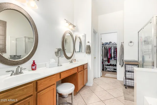 a bathroom with a sink double vanity and a mirror