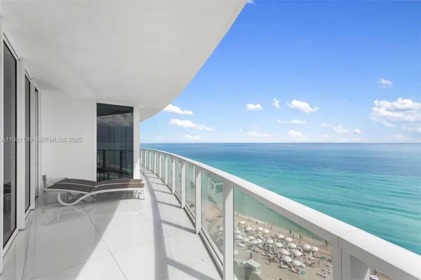 a view of balcony with ocean