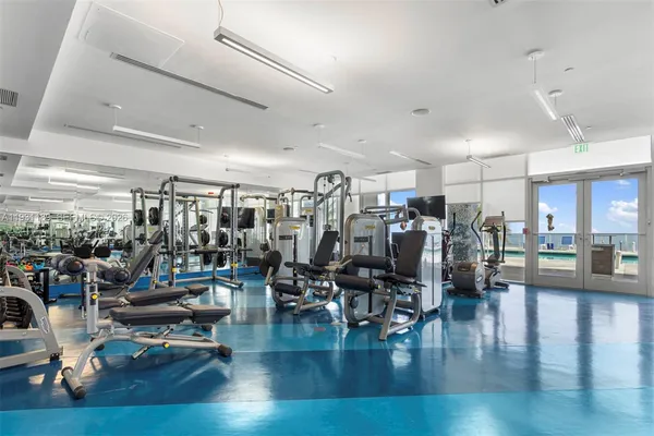a bathroom with a shower and a sink