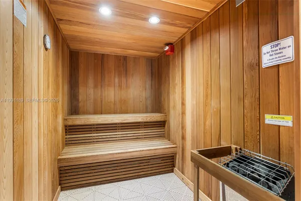 a view of a outdoor kitchen with a table and chairs