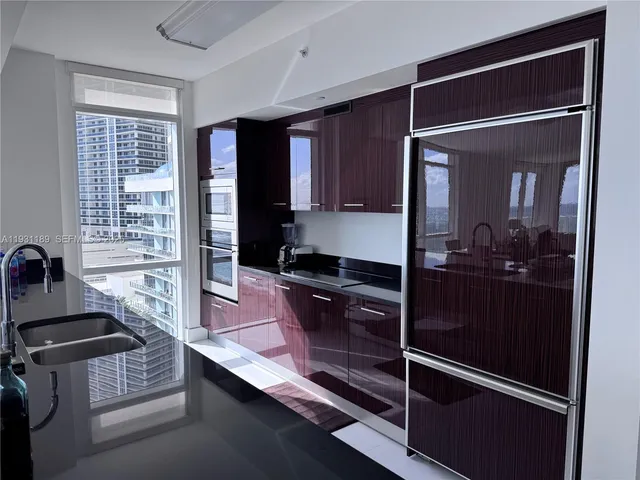 a kitchen with counter top space and stainless steel appliances