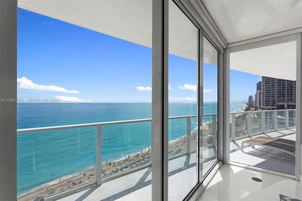 a bedroom with a bed and a view of bathroom