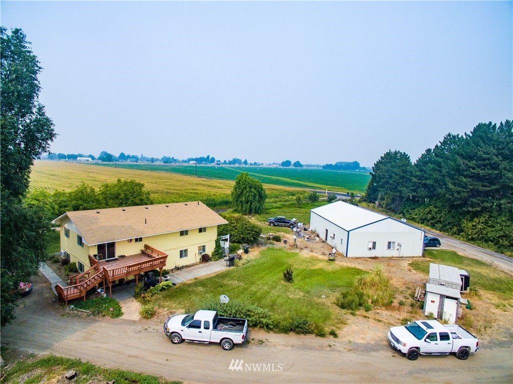 3956 L L.2 Road Northeast Moses Lake, WA 98837 - Photo 1 of 14 an aerial view of a house with garden space and street view