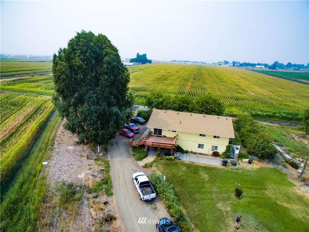 3956 L L.2 Road Northeast Moses Lake, WA 98837 - Photo 2 of 14 an aerial view of a house with a garden and swimming pool