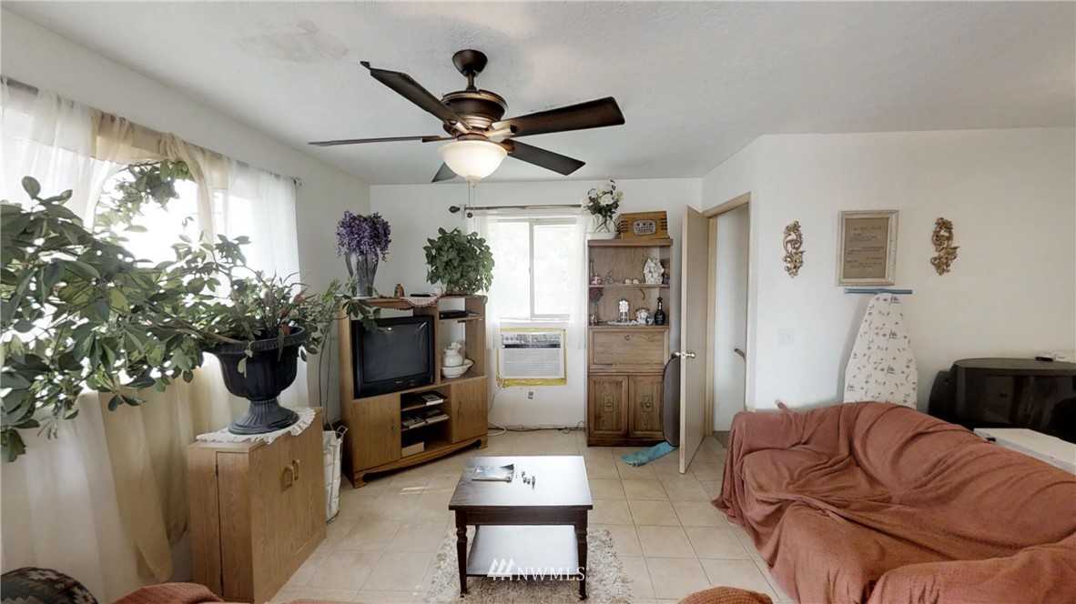 3956 L L.2 Road Northeast Moses Lake, WA 98837 - Photo 8 of 14 a living room with furniture and a flat screen tv