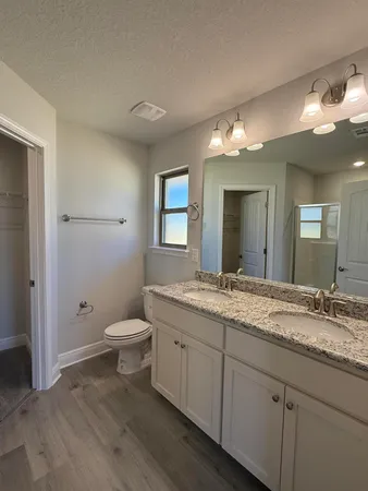 a bathroom with a glass shower door