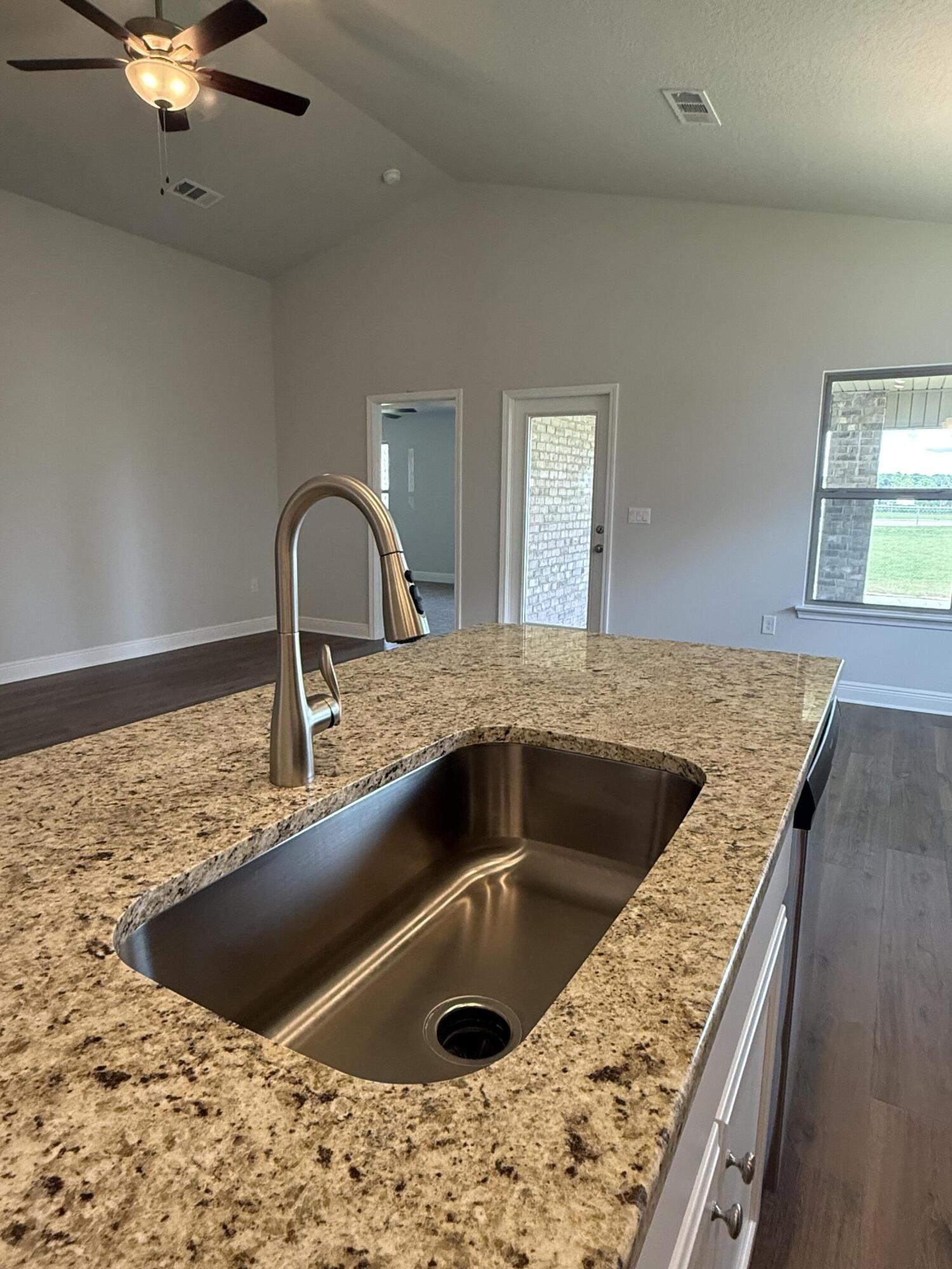 190 Ridgeway Circle Crestview, FL 32536 - Photo 12 of 19 a kitchen with a faucet a sink and a stove